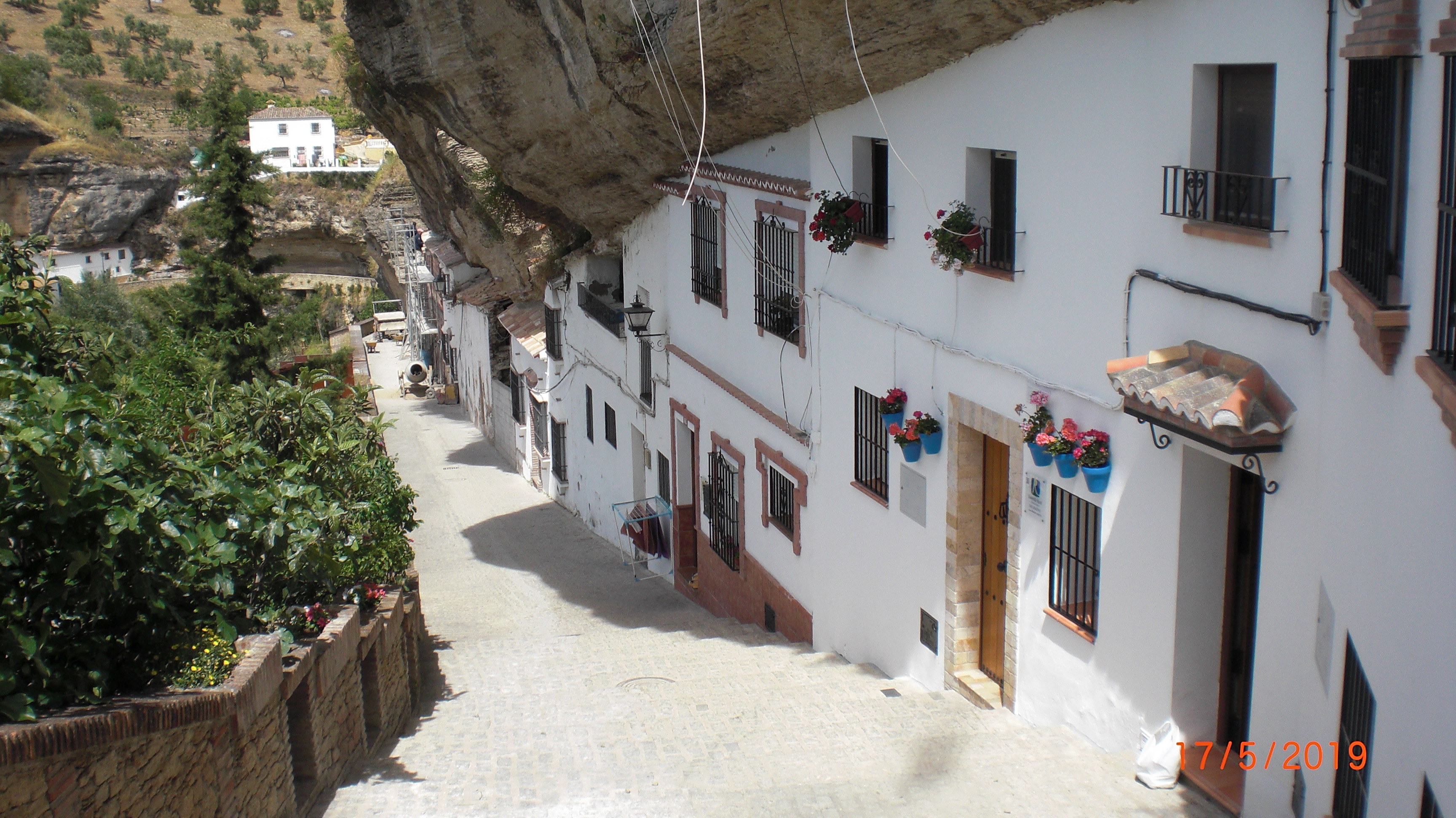 Rock hanging over the houses
