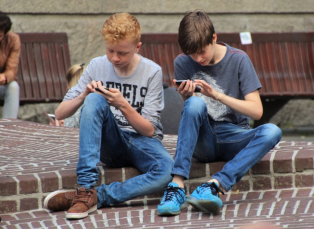 Young Boys with their Mobile Phone